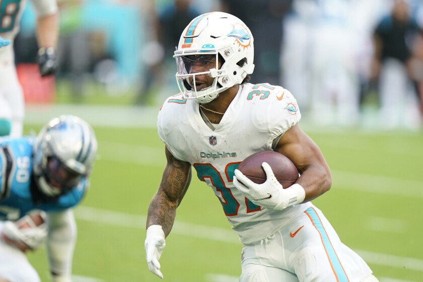 Miami Dolphins running back Myles Gaskin (37) runs for a touchdown during the second half of an NFL football game against the Carolina Panthers, Sunday, Nov. 28, 2021, in Miami Gardens, Fla. (AP Photo/Wilfredo Lee)