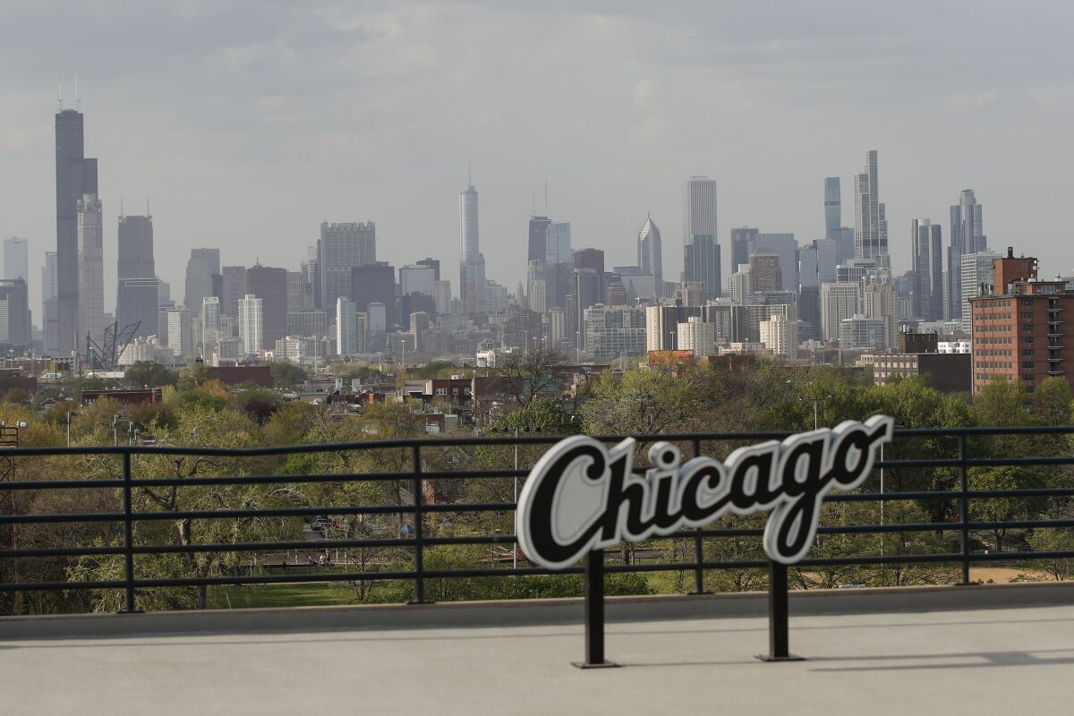 FILE - Chicago's skyline is seen from the Guaranteed Rate Field before a baseball game between the Chicago White Sox and Detroit Tigers, Tuesday, April 27, 2021, in Chicago. Chicago on Tuesday announced a bid to bring the Democratic National Convention that will choose the party's presidential nominee to the city in 2024. The announcement was accompanied by endorsements from top Illinois Democrats, including Gov. J.B. Pritzker and Chicago Mayor Lori Lightfoot. (AP Photo/Kamil Krzaczynski, File)