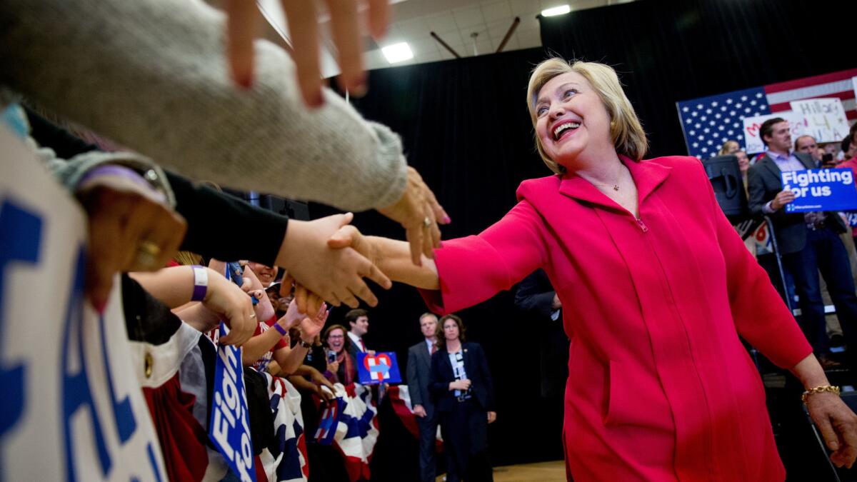 Democratic presidential candidate Hillary Clinton, center, arrives to speak at a get-out-the-vote event at Transylvania University in Lexington, Ky.