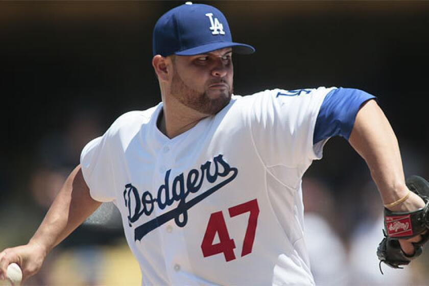 Dodgers pitcher Ricky Nolasco throws against the Colorado Rockies on Sunday.