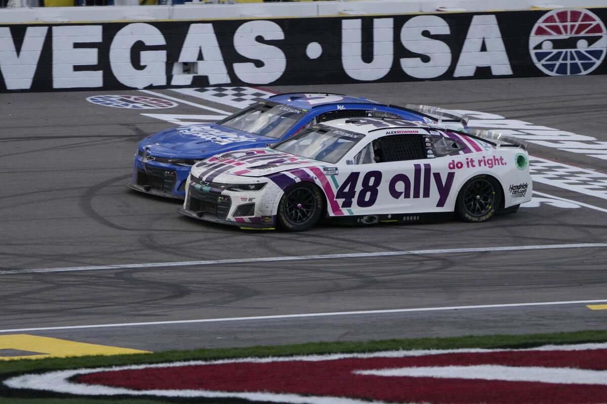 Alex Bowman (48) races beside Kyle Larson (5) during a NASCAR Cup Series auto race Sunday in Las Vegas. 