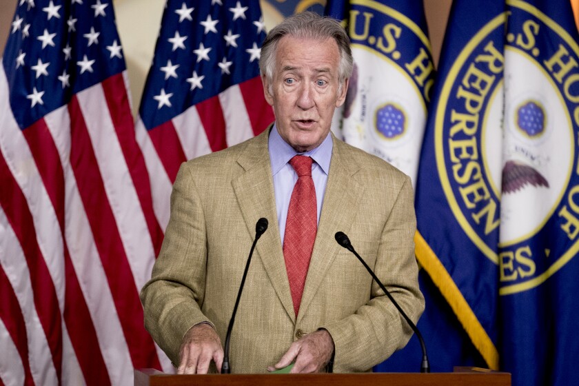 Rep. Richard Neal (D-Mass.) stands and speaks behind a podium at a news conference on Capitol Hill in Washington.
