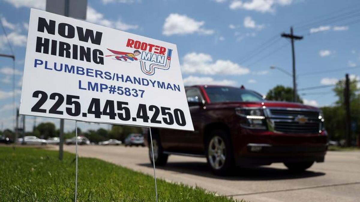 A "now hiring" sign is seen in Baton Rouge, La., on May 5.