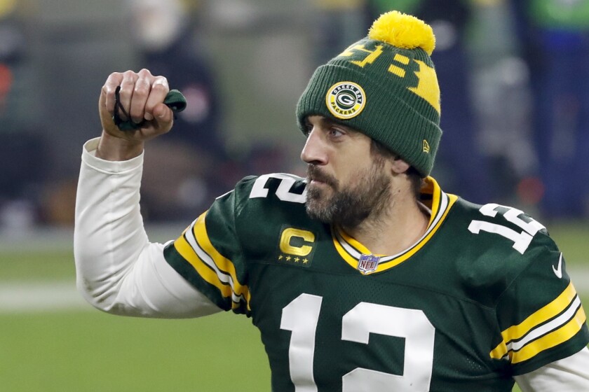 Green Bay Packers quarterback Aaron Rodgers pumps his fist after an NFL divisional playoff football game against the Los Angeles Rams Saturday, Jan. 16, 2021, in Green Bay, Wis. The Packers defeated the Rams 32-18 to advance to the NFC championship game. (AP Photo/Mike Roemer)