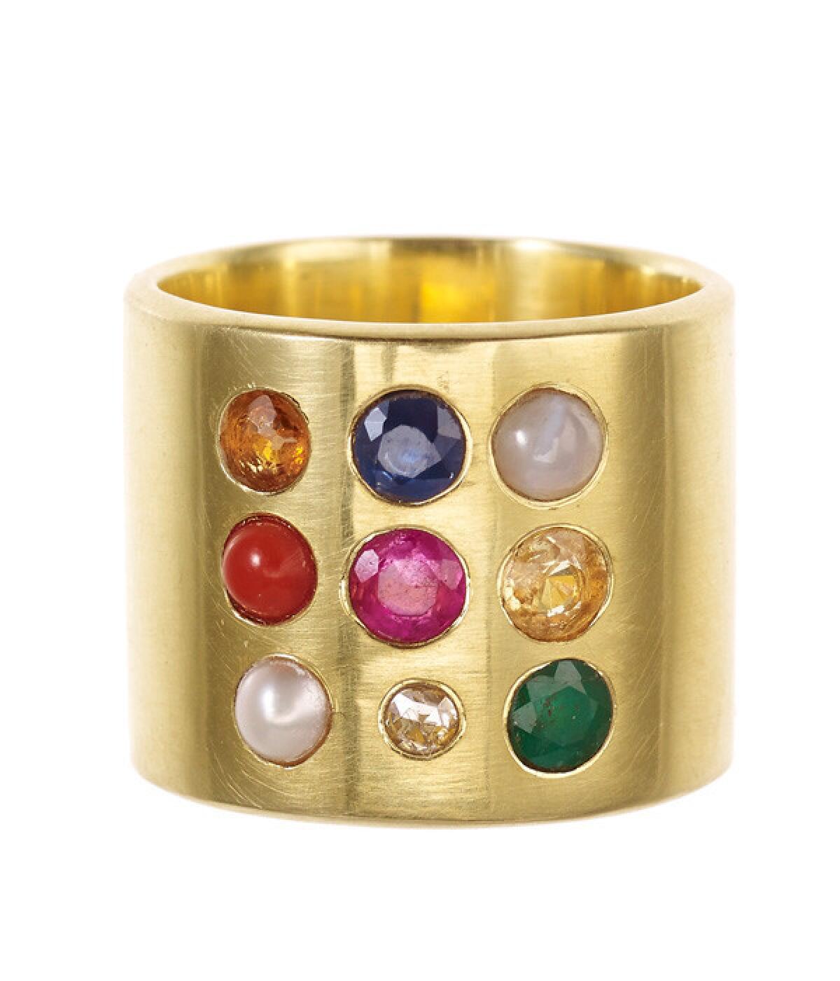 Pippa Small "Navrtana" ring in 18-karat gold with gems representing the nine planets: ruby, diamond, pearl, coral, yellow sapphire, emerald, hessonite, blue sapphire and cat's eye.
