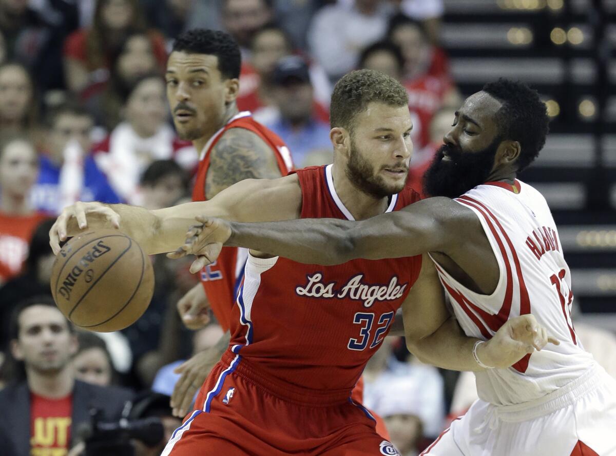 Rockets guard James Harden tries to steal the ball from Clippers forward Blake Griffin in the second half.