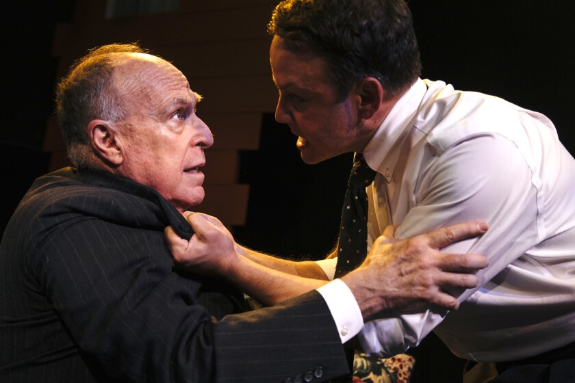 The sins of the father (Richard Fancy, left) shatter the illusions of a naive idealist (Marc Valera) in “All My Sons” at Pacific Resident Theatre in Venice.