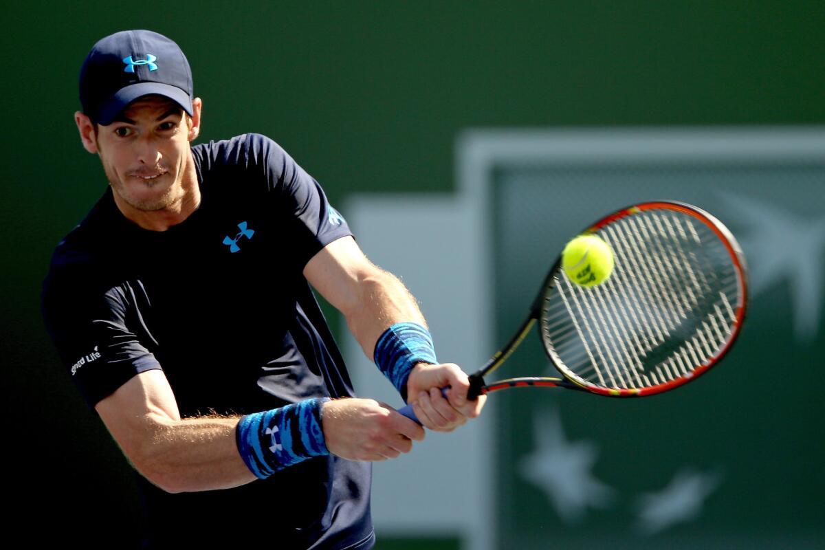Andy Murray returns a shot against Feliciano Lopez, who Murray beat for the 10th time in 10 tries, during the BNP Paribas Open in Indian Wells, Calif.