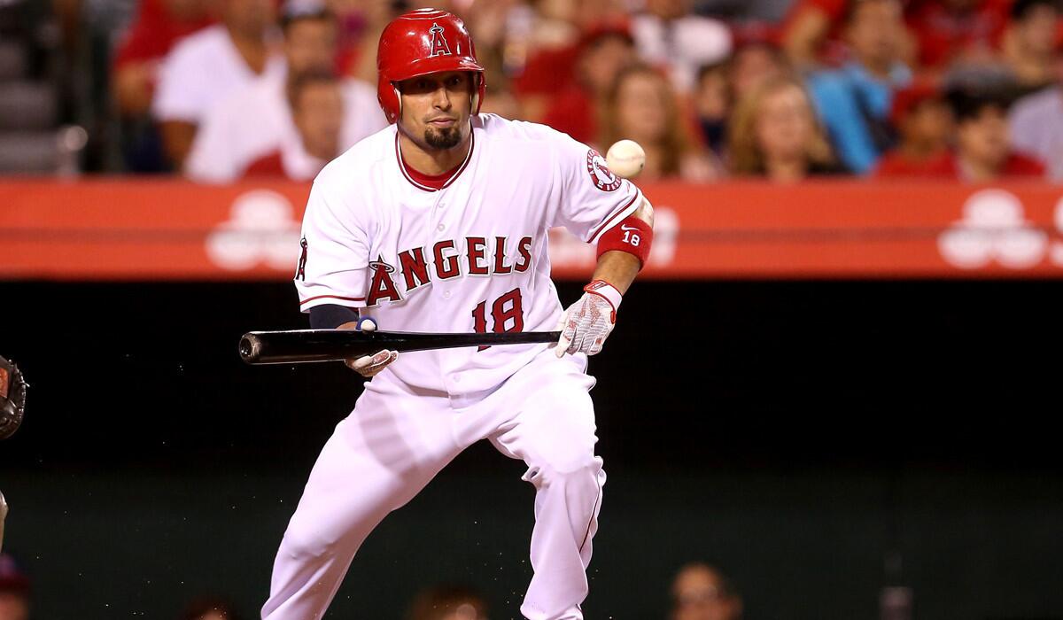 Angels' Shane Victorino lays down a succesful sacrifice bunt in the fifth inning against the Oakland Athletics on Monday.