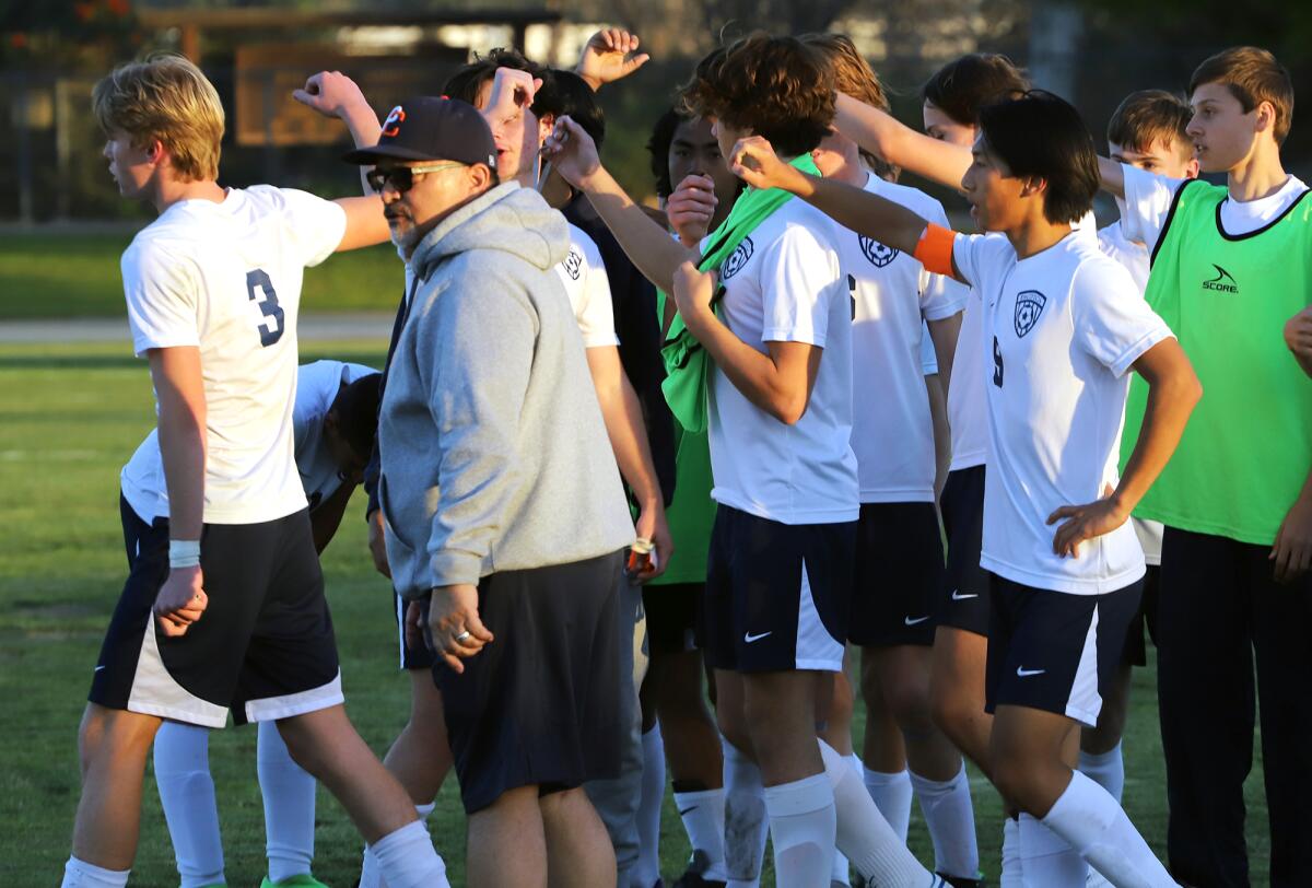 The Pacifica Christian boys' soccer team high-fives after their game against South El Monte on Tuesday.