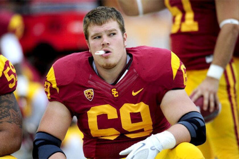 Cyrus Hobbi was thrust into the starting center position for USC last season against Stanford when senior Khaled Holmes went down with injury. The Trojans line was unable to protect quarterback Matt Barkley and fans directed their anger at Hobbi, who turned that experience into a 15-minute dramatic solo performance.