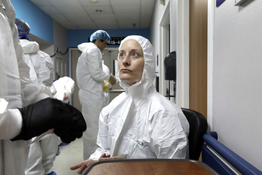HOUSTON, TEXAS--MAY 6, 2020--Reporter Molly Hennessy-Fiske listens to instructions before getting an antibody test to check for the coronavirus before entering the Covid-19 unit at United Memorial Medical Center In Houston, Texas Covid-19 unit. (Carolyn Cole/Los Angeles Times)