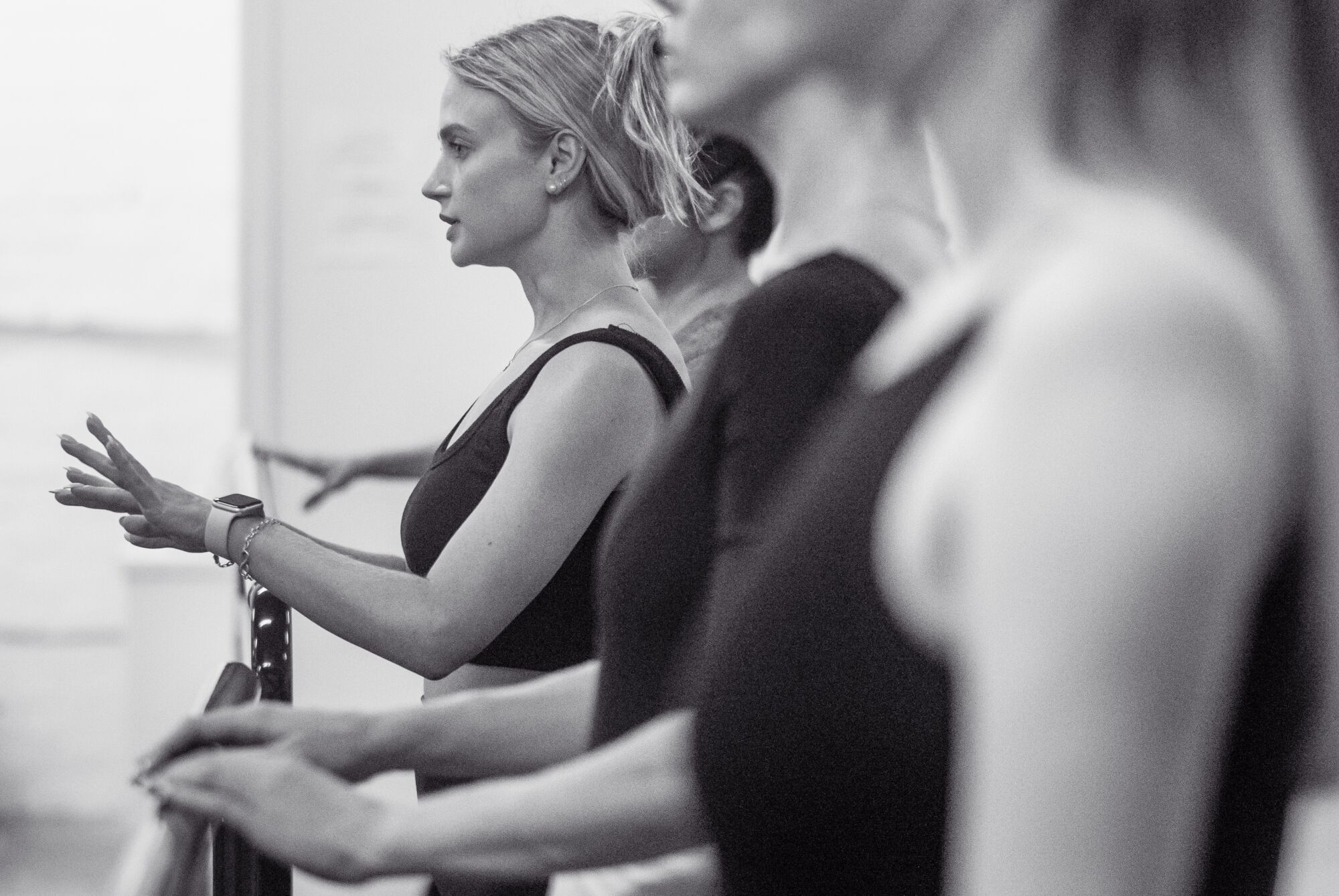 Ballet dancers at the barre.