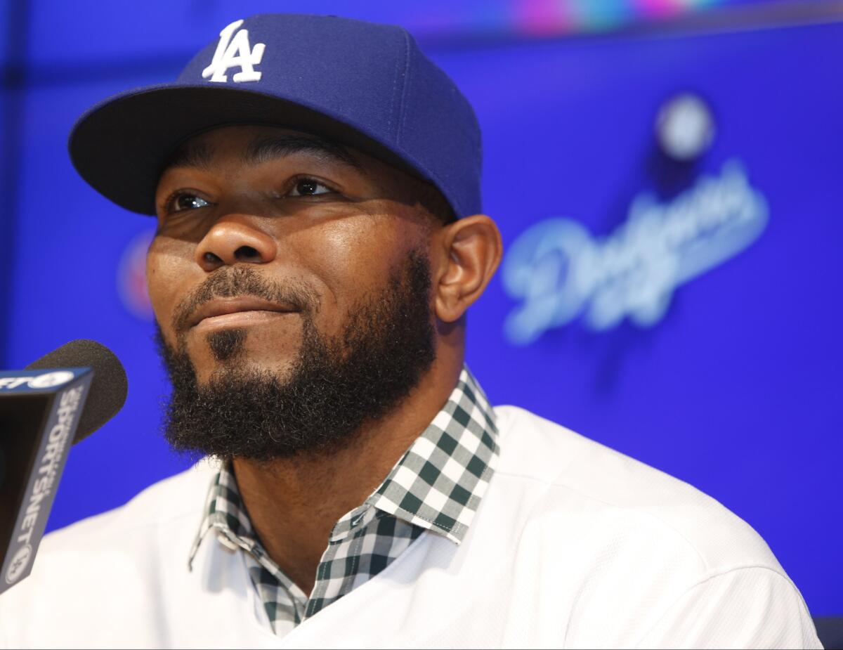 Dodgers second baseman Howie Kendrick takes questions during an introductory news conference on Dec. 19.