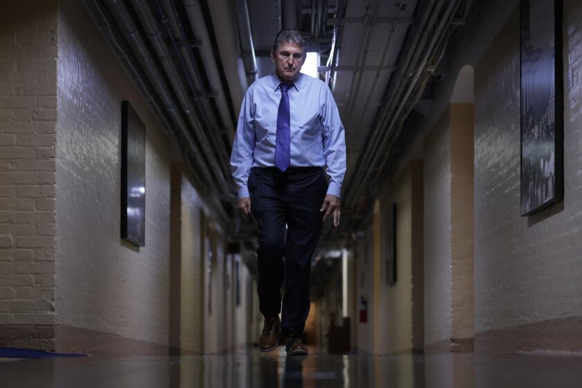 WASHINGTON, DC - DECEMBER 15: U.S. Sen. Joe Manchin (D-WV) walks through a hallway in the basement of the U.S. Capitol December 15, 2021 in Washington, DC. President Joe Biden said on Wednesday that he would support to push the vote for the Build Back Better legislation to 2022 and for the Senate to pass a voting rights bill instead. (Photo by Alex Wong/Getty Images)