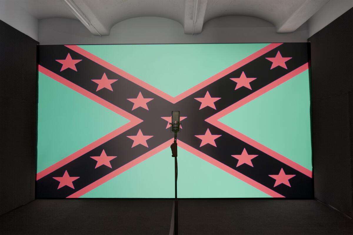 In a still from Black Righteous Space, a 2012 multimedia work by Hank Willis Thomas, the Confederate flag is recast using colors associated with the Pan-African flag. (Hank Willis Thomas / Jack Shainman Gallery, New York)