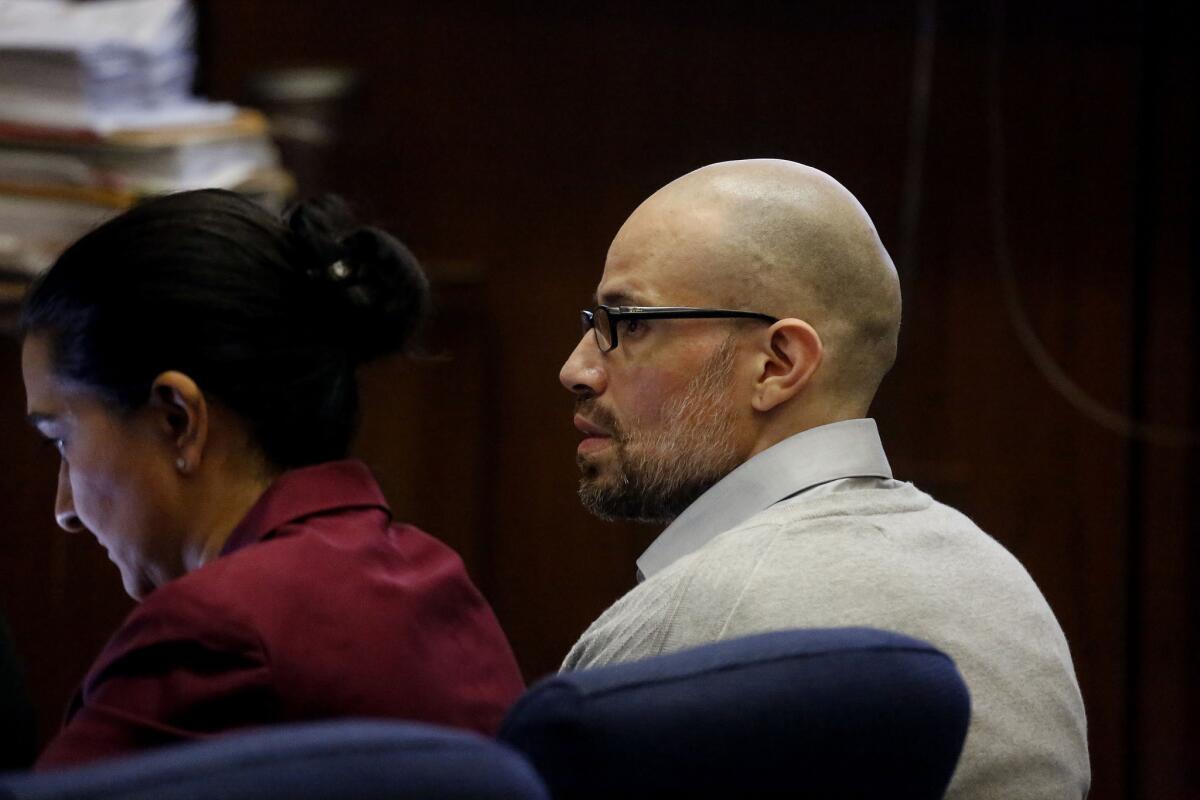 Edward Garcia Jr., accused in a ritual killing in a skid row hotel, listens in court Thursday.