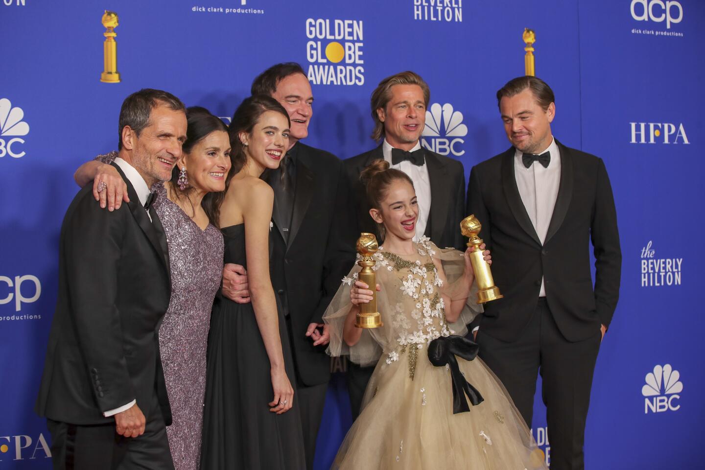 David Heyman, left, Shannon McIntosh, Margaret Qualley, Quentin Tarantino, Brad Pitt, Leonardo DiCaprio and Julia Butters for “Once Upon a Time... in Hollywood” in the photo deadline room.