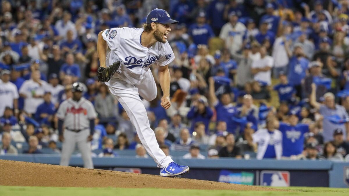 Dodgers' Clayton Kershaw pitches in the first inning in Game 2 of the National League Divisional Series at Dodger Stadium.