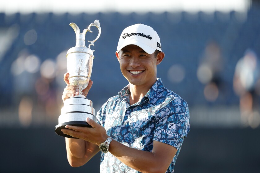 Collin Morikawa holds the Claret Jug after winning the British Open at Royal St George's Golf Club.