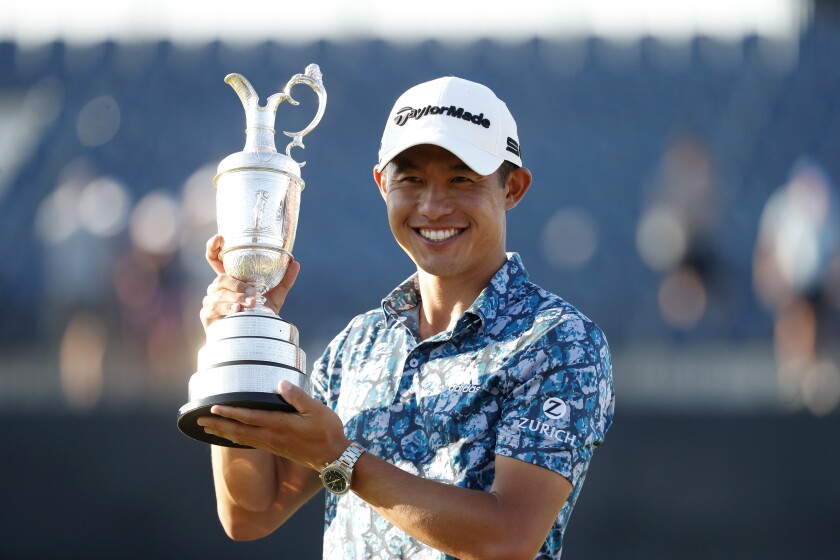 Collin Morikawa holds the Claret Jug after winning the British Open at Royal St. George's Golf Club.