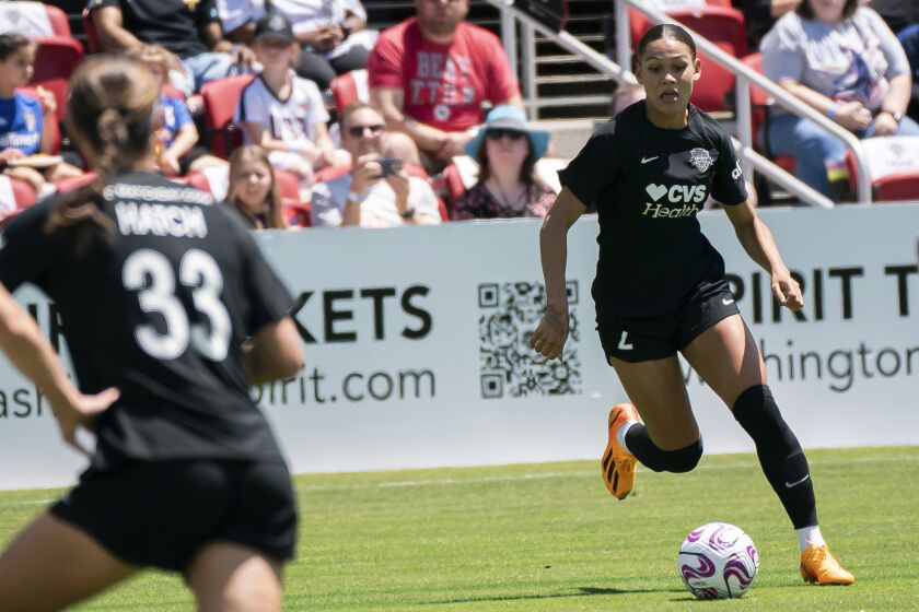 Spirit's Trinity Rodman (2) dribbles into Wave's territory during a match against the San Diego Wave FC at Audi Field on Saturday, May 6, 2023, in Washington. (AP Photo/Nathan Howard)