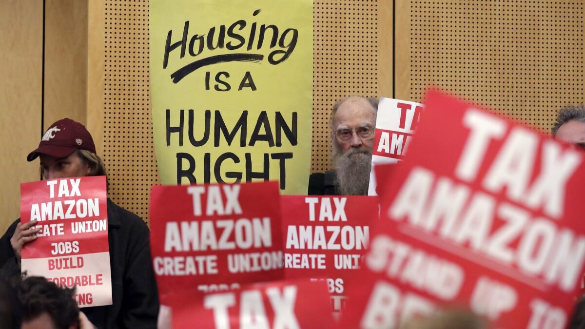 Supporters of the new tax on Seattle's largest companies at a City Council meeting Monday.