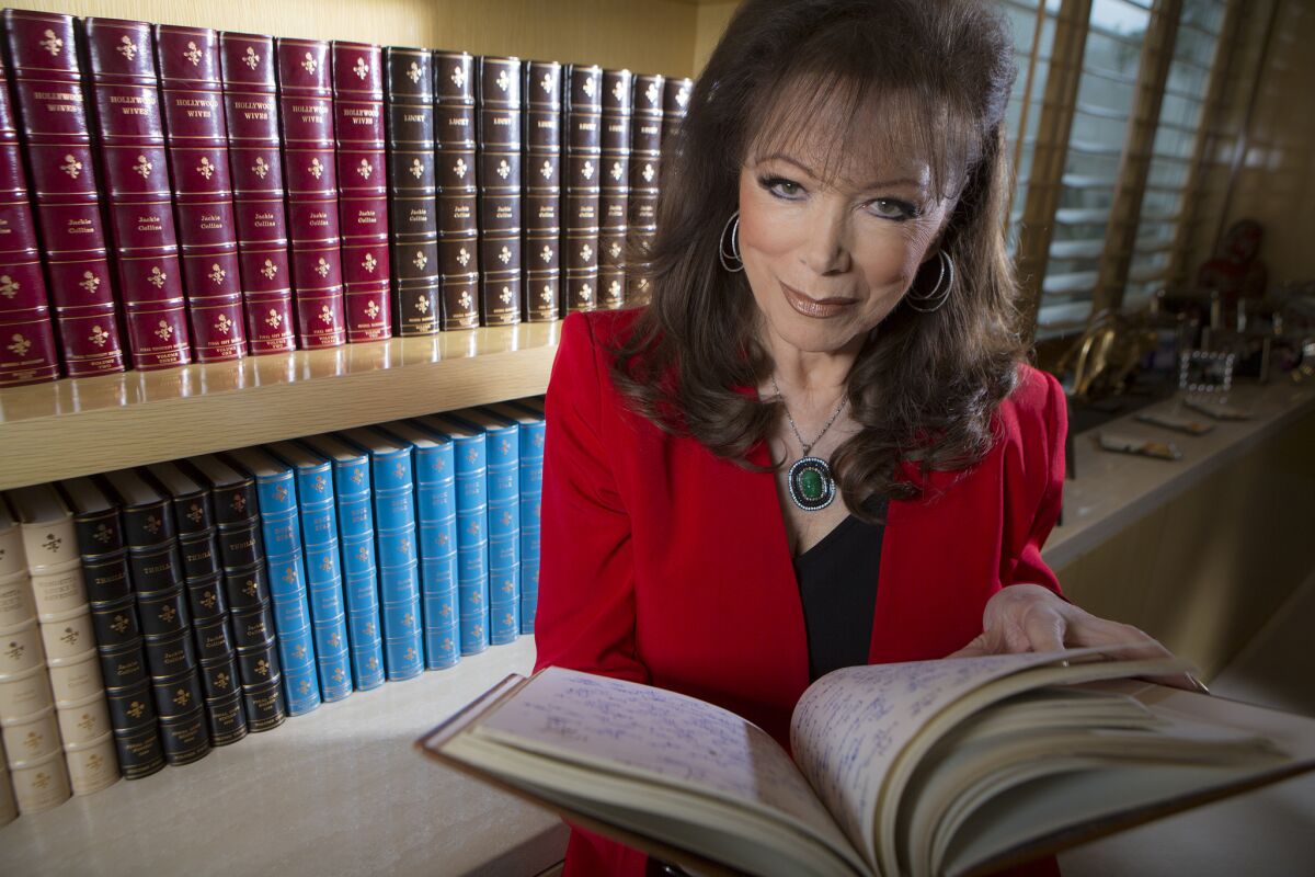 Author Jackie Collins with her leatherbound manuscripts. She died Saturday at 77. She was beloved by readers, who saw the fun in the heightened reality she portrayed.