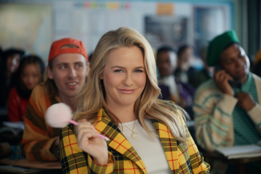 This photo provided by Rakuten Rewards shows Alicia Silverstone in a scene from Rakuten Rewards 2023 Super Bowl NFL football spot. Big name advertisers are paying as much as $7 million for a 30-second spot during the big game on Sunday, Feb. 12, 2023. In order to get as much as a return on investment for those million, most advertisers release their ads in the days ahead of the big game to get the most publicity for their spots. (Rakuten Rewards via AP)
