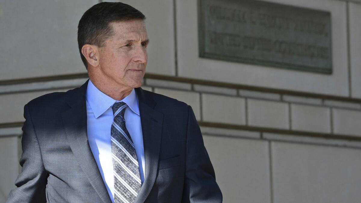 In this Dec. 1, 2017, file photo, former Trump national security adviser Michael Flynn leaves federal court in Washington.