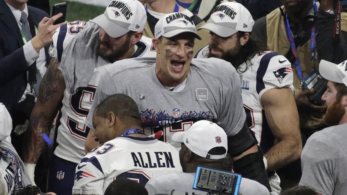 Patriots tight end Rob Gronkowski celebrates with teammates after beating the Los Angeles Rams in Super Bowl LIII in February.