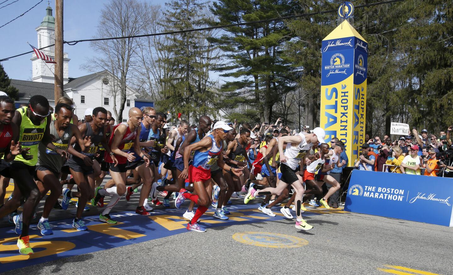 Meb Keflezighi, a Boston Marathon winner, throws out the ceremonial first  pitch before a baseball game between the Boston Red Sox and the Los Angeles  Angels, Friday, April 14, 2023, in Boston. (