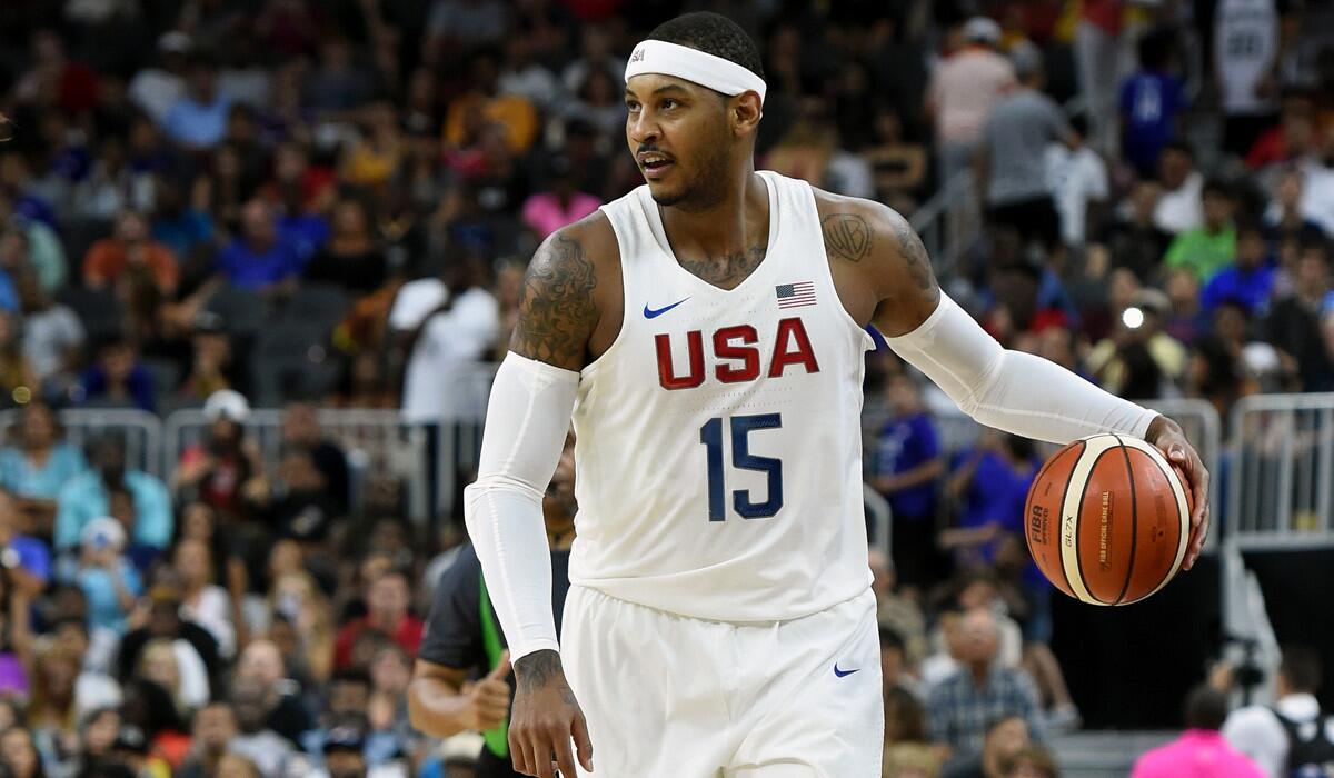 Team USA's Carmelo Anthony brings the ball up the court against Argentina during a USA Basketball showcase exhibition game on Friday.