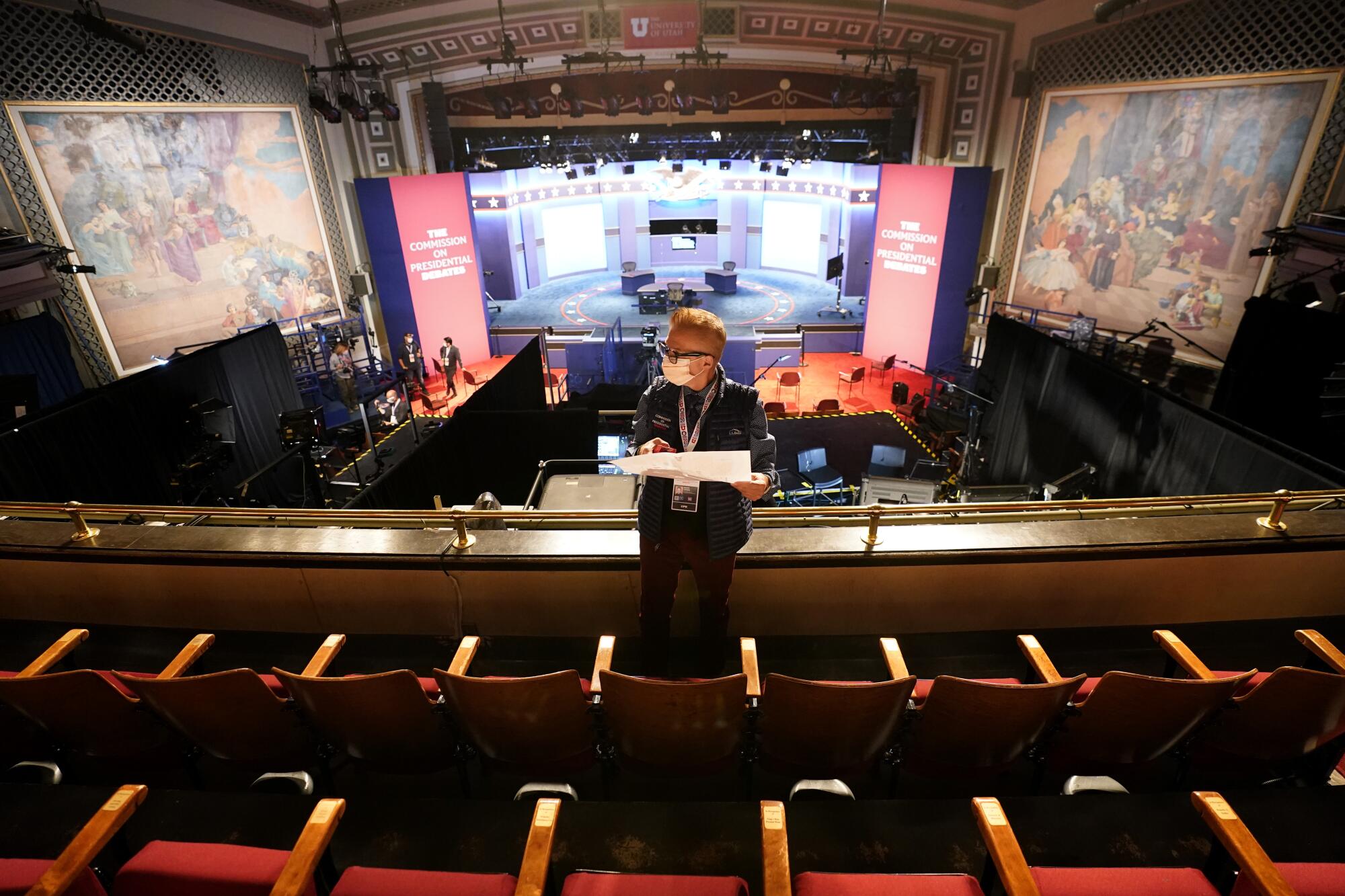 A member of the production staff in the debate hall.