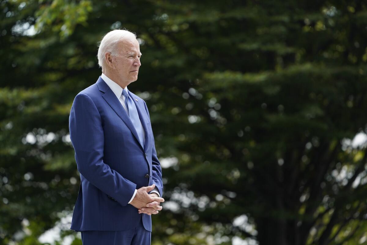 President Biden waits to speak on the North Lawn of the White House.