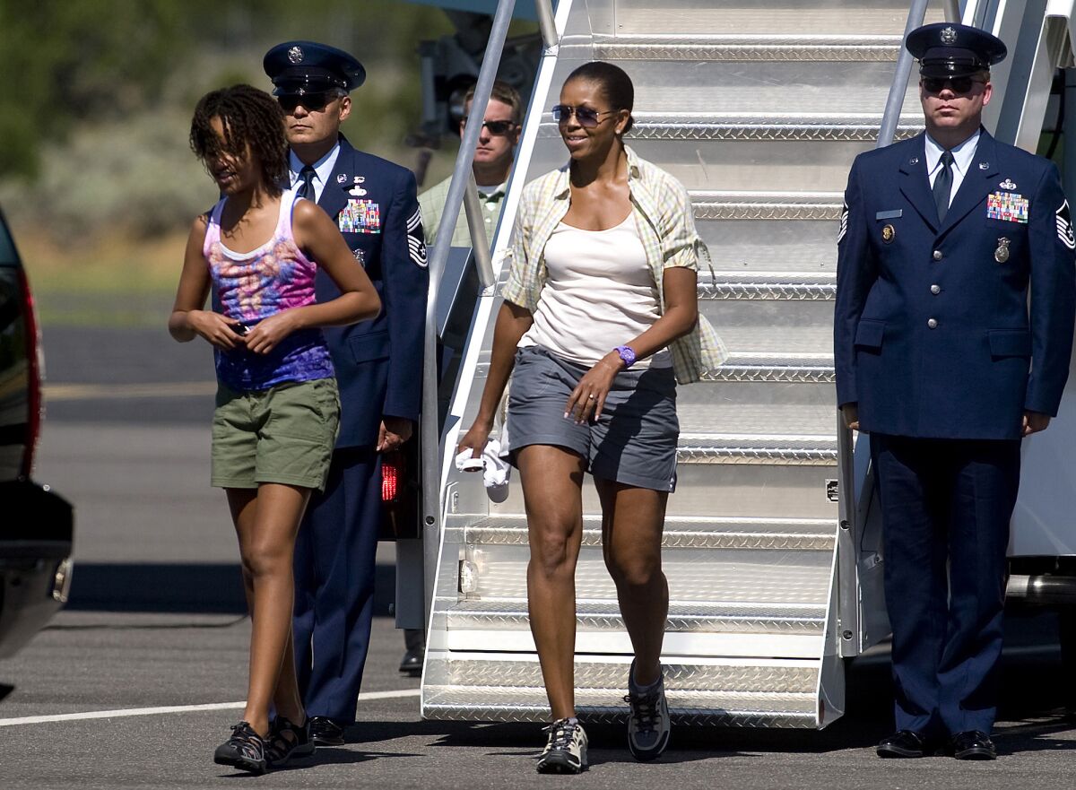 First Lady Michelle Obama wears shorts as she disembarks from Air Force One while on a family vacation.