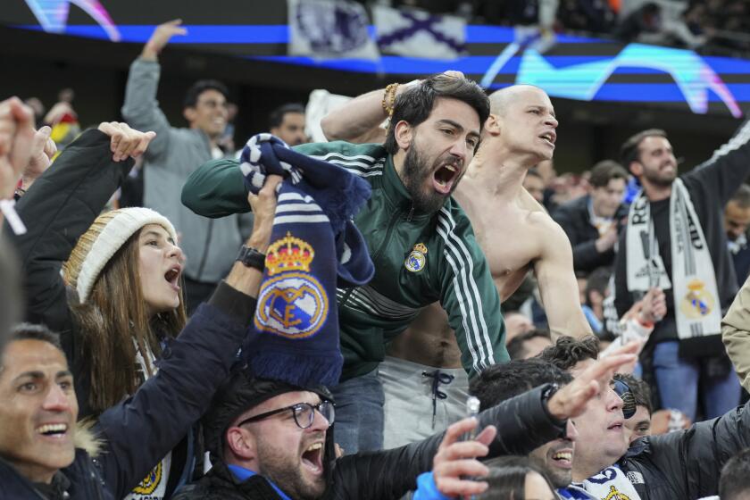 Real Madrid Fans celebrate victory during the Champions League quarterfinal second leg soccer match between Manchester City and Real Madrid at the Etihad Stadium in Manchester, England, Wednesday, April 17, 2024. (AP Photo/Dave Shopland)