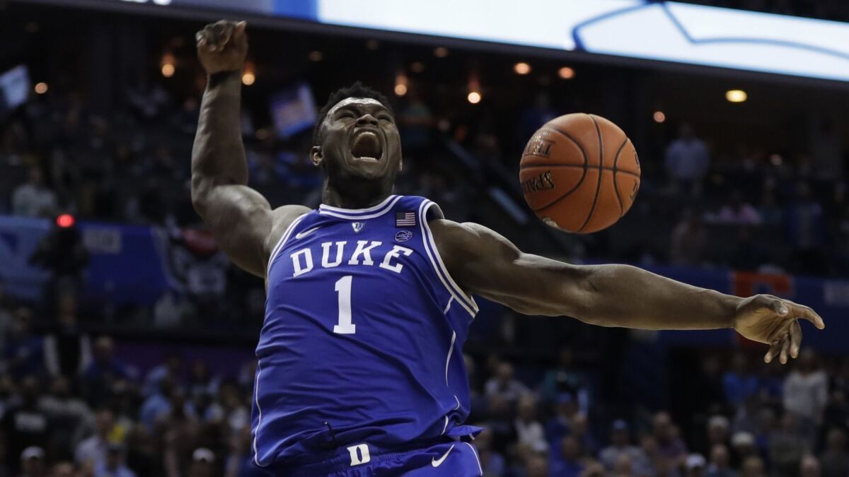 Duke's Zion Williamson reacts after dunking against North Carolina on March 15. Williamson is expected to be the No. 1 overall pick in this year's NBA draft.
