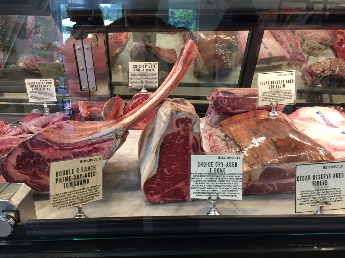 Dry-aged beef products for sale in the meat counter at newly opened The Butchery market in Del Mar's One Paseo project.