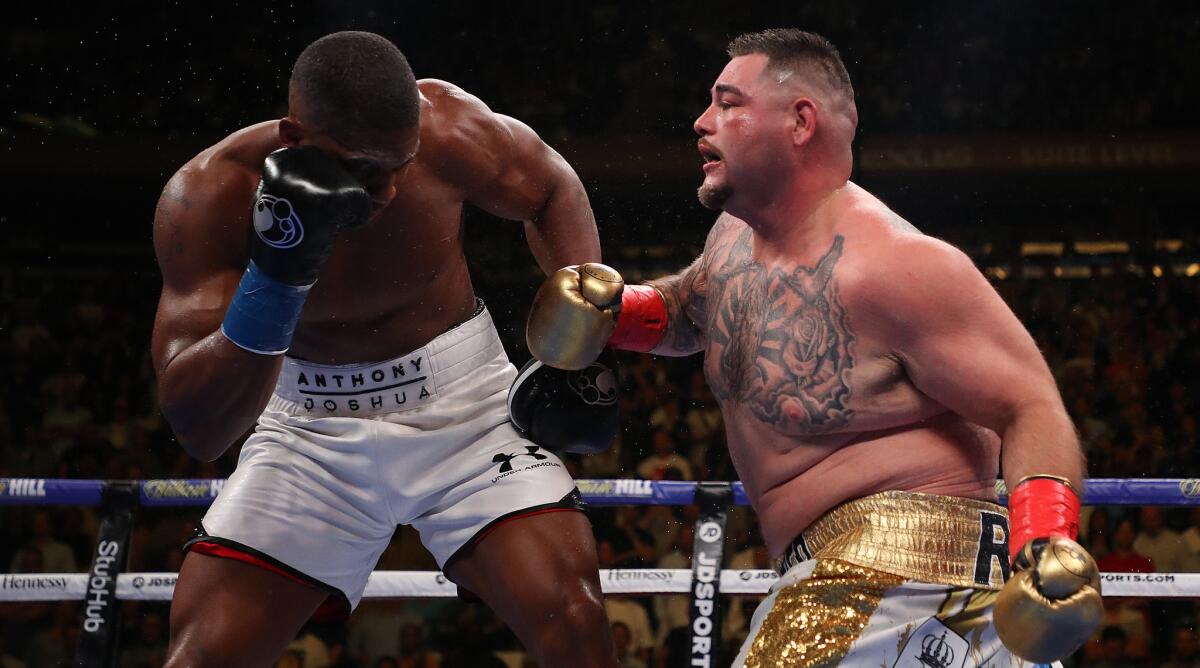 Andy Ruiz, right, punches Anthony Joshua during their heavyweight title fight.