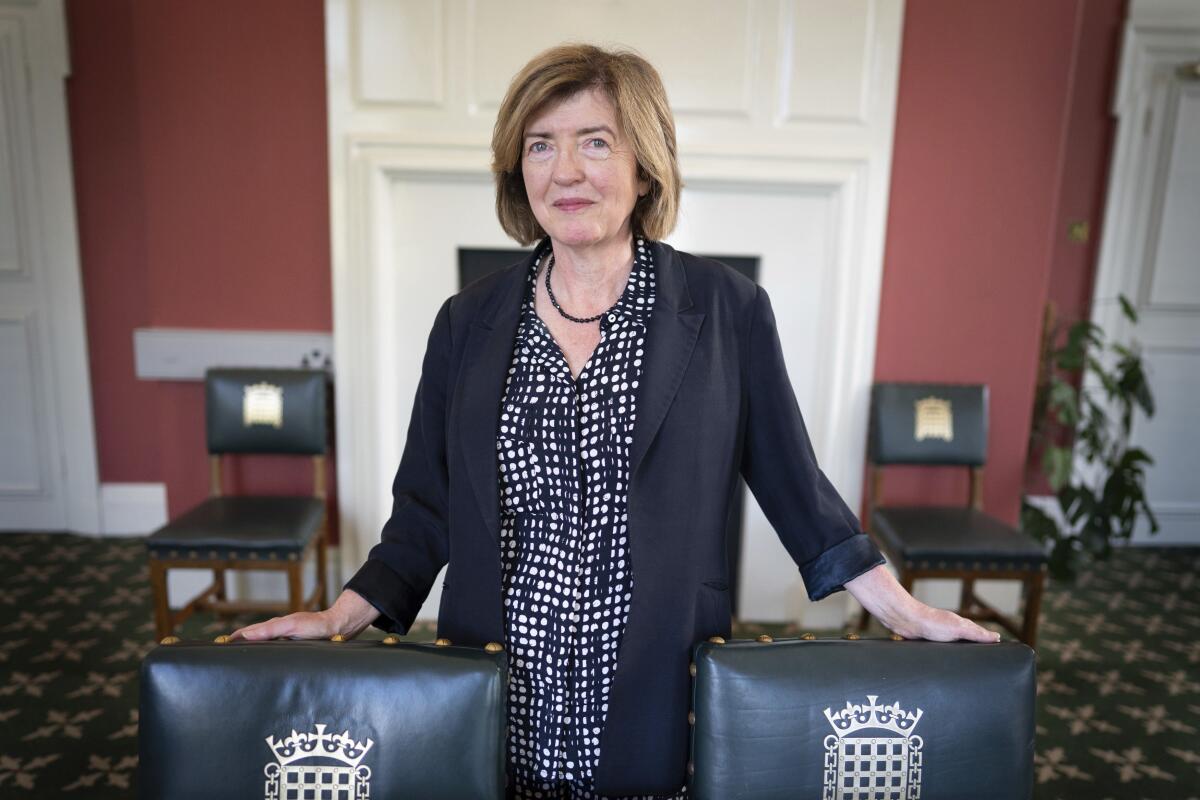 Sue Gray poses in an office.