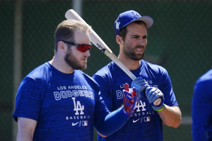 Los Angeles Dodgers' Chris Taylor, right, stands with Max Muncy as the two take batting practice.