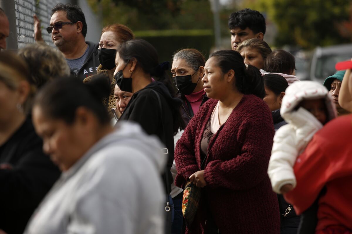Worried parents wait to collect their children where at least eight students from Van Nuys Middle School.