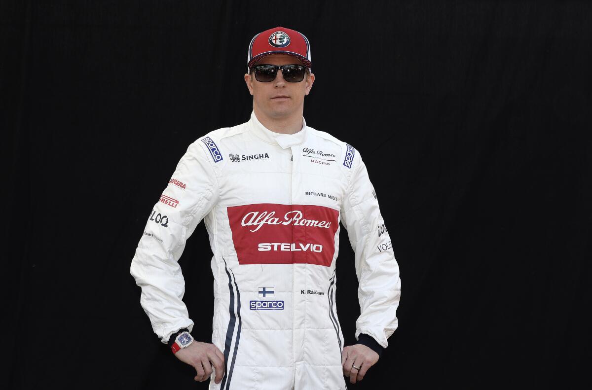 FILE - Alfa Romeo driver Kimi Raikkonen, of Finland, poses for a photo ahead of the Australian Grand Prix in Melbourne, Australia, March 14, 2019. Raikkonen will take a break from his retirement to return to racing this weekend in the NASCAR race at Watkins Glen. (AP Photo/Rick Rycroft, File)