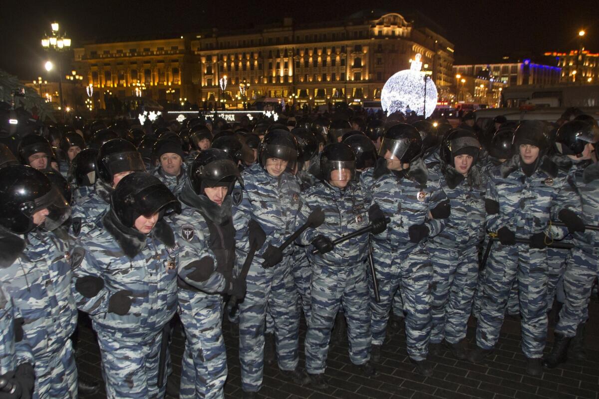 Special police forces in Moscow gird late Tuesday for a sweep against opposition protesters at Manezh Square, adjacent to the Kremlin. Thousands defied a law banning unsanctioned demonstrations to support Kremlin critic Alexei Navalny.