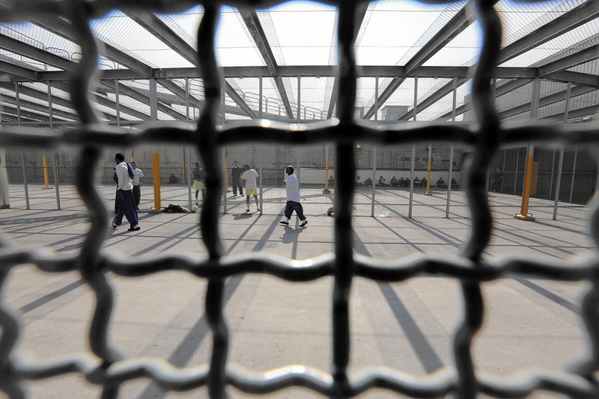 At Men's Central Jail in Los Angeles, many inmates get out of their cells for only three hours a week. Here, inmates exercise on the roof.