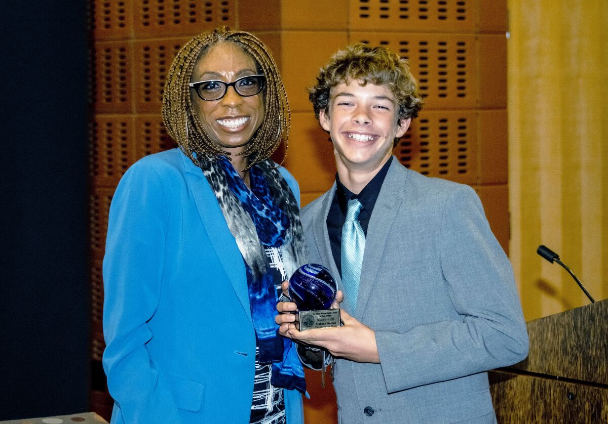 San Diego City Councilwoman Monica Montgomery presenting the “Most Remarkable Teen” award to Makena Stumpo at the ceremony.