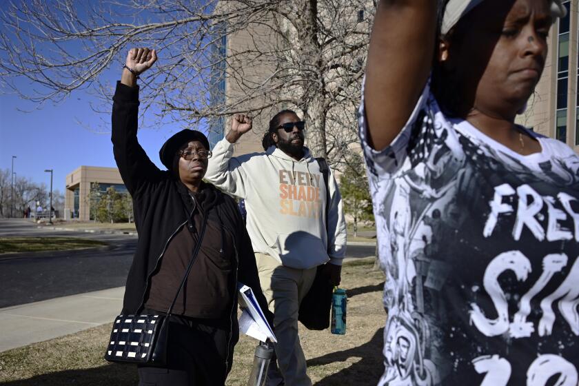 Sheneen McClain, left, the mother of Elijah McClain, and a supporter leave the Adams County Justice Center in Brighton, Colo. on Friday, March 1, 2024. Peter Cichuniec, a Colorado paramedic was sentenced Friday to five years in prison for the death of Elijah McClain in a rare prosecution of medical responders that has left officials rethinking how they treat people in police custody. (Hyoung Chang/The Denver Post via AP)