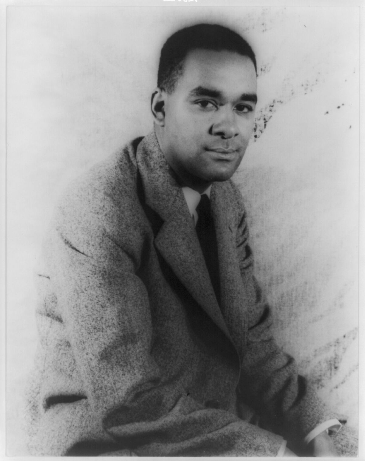 A photograph of Richard Wright, wearing a suit jacket