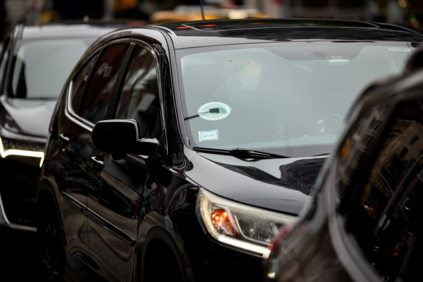 Uber signage on a vehicle in New York, US, on Thursday, Aug. 8, 2024. In the past two weeks, Uber Technologies Inc., DoorDash Inc., Instacart, Grubhub parent Just Eat Takeaway, and Deliveroo Plc have all delivered upbeat earnings reports, suggesting that ride-sharing and food delivery are both entrenched habits baked into consumer's budgets, and serving as a counterpoint to fears that US consumer spending is softening across the board. Photographer: Yuki Iwamura/Bloomberg